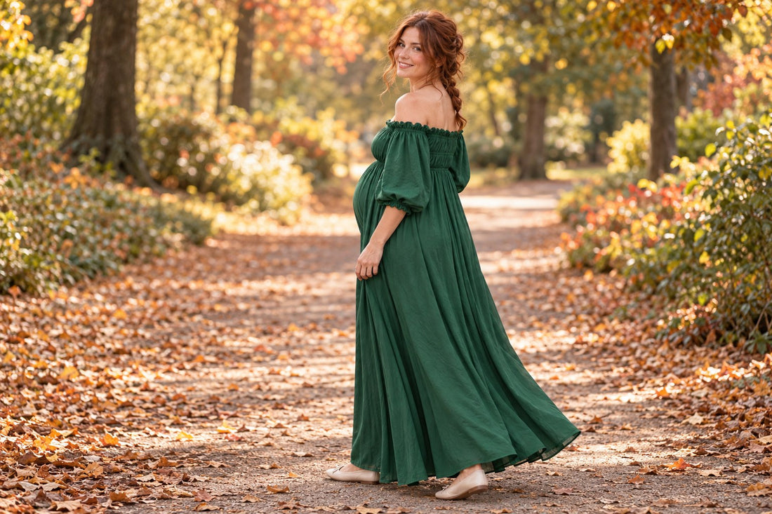 Mom-to-be in a forest green maternity dress on an autumn park path, looking back with a smile