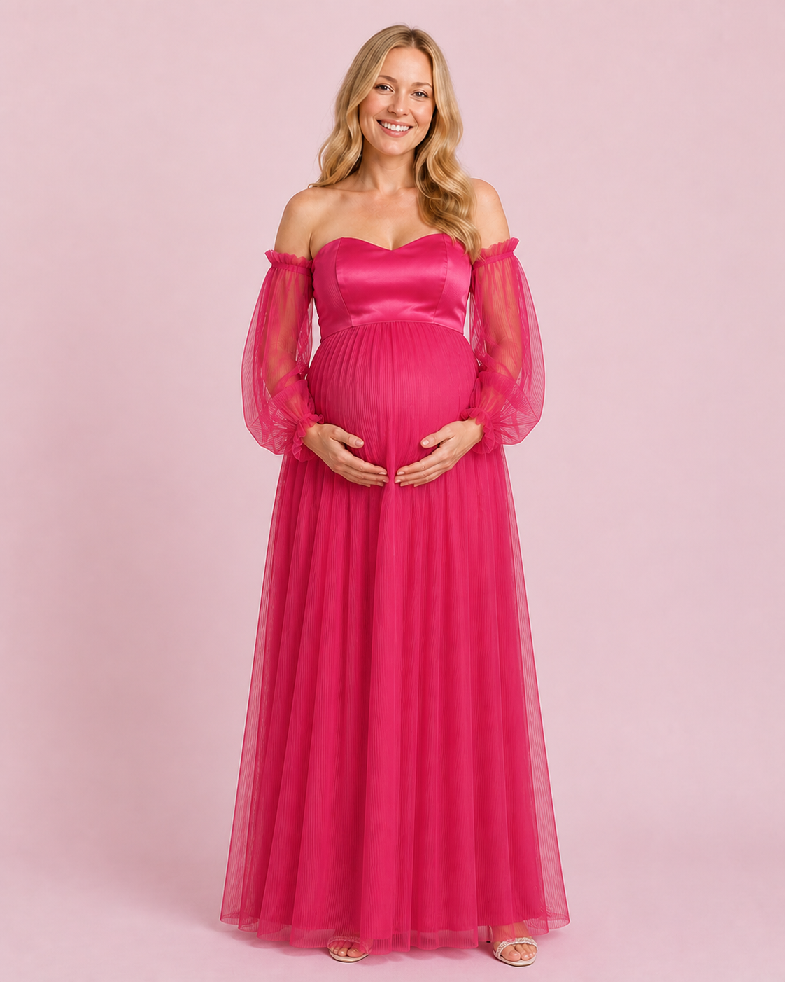 Front view of the fuchsia maternity gown with a sweetheart neckline, sheer long sleeves and a pleated full-length skirt.