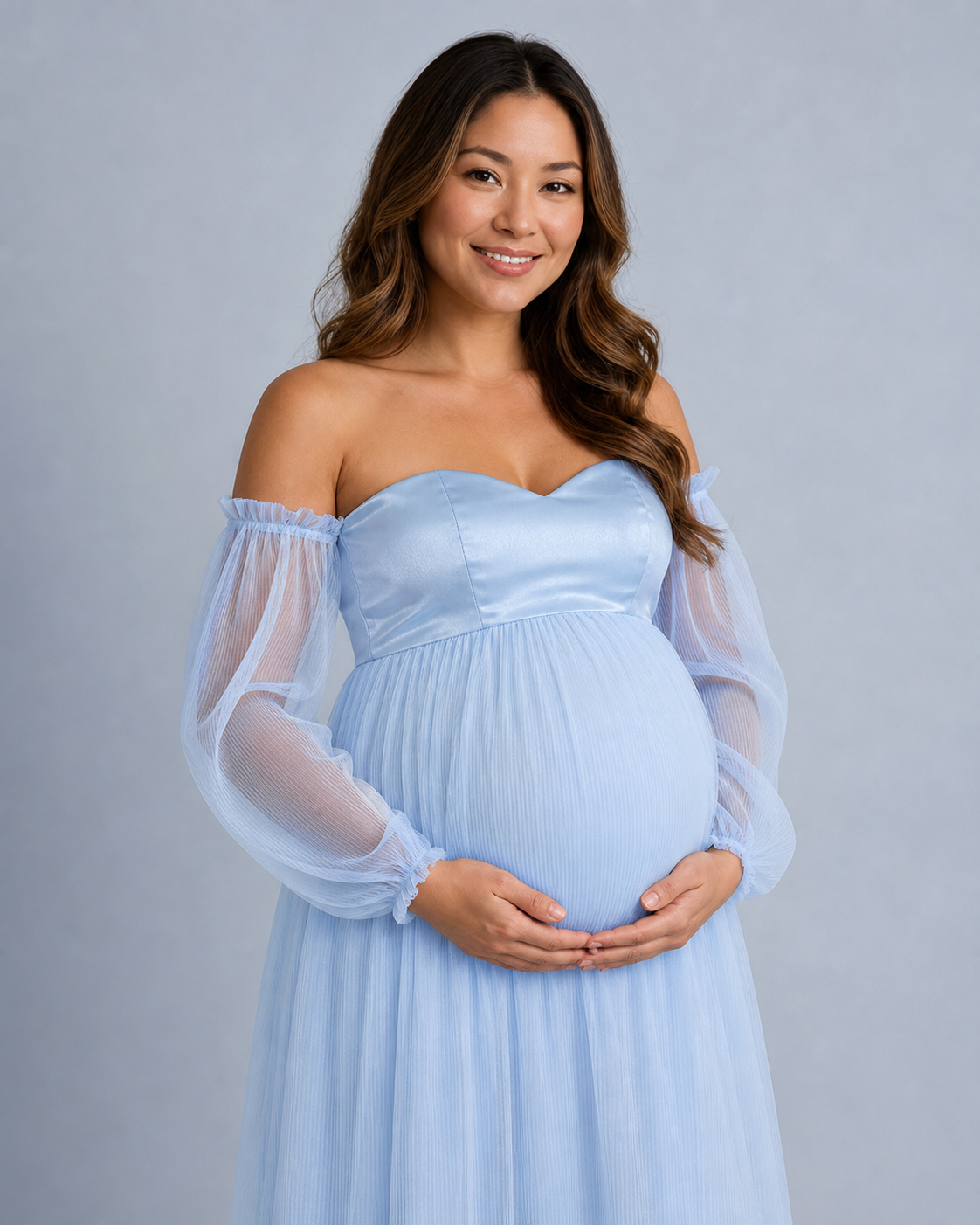 Sky blue gown close-up showing the sweetheart neckline, shaped bodice panels and sheer pleated sleeves.
