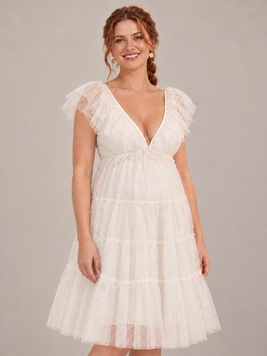 Cosette Ivory maternity dress — deep V-neckline, flutter sleeves and high waist in a half-length view