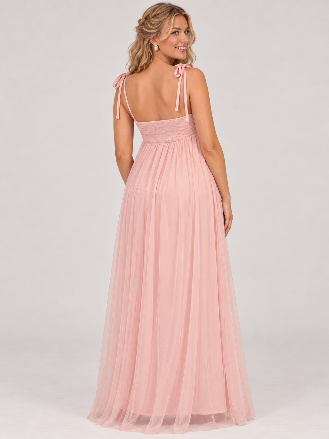 Juliette Blush Pink maternity dress — back view of the smocked panel and long tulle skirt