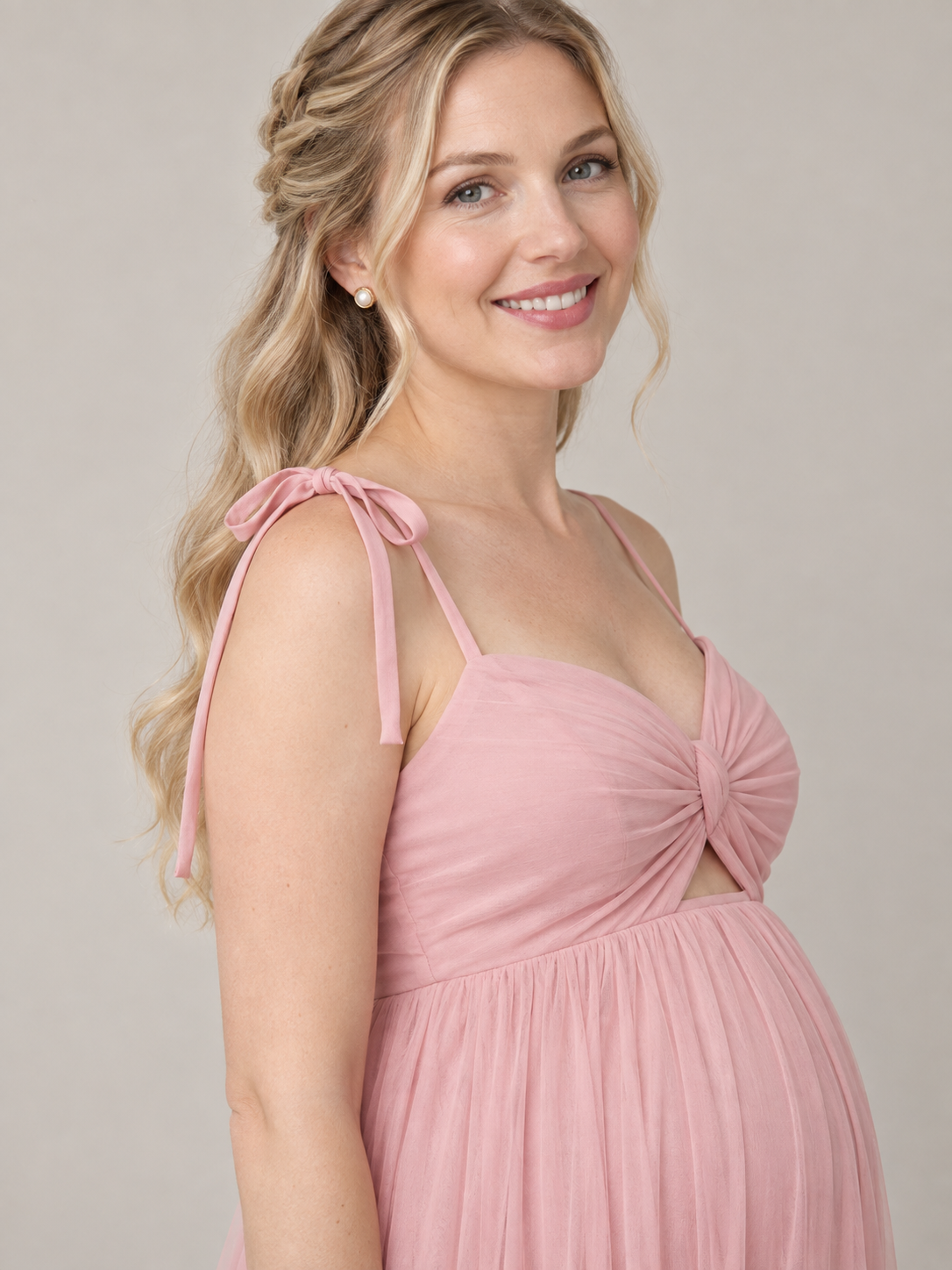 Juliette Blush Pink maternity dress — shoulder bow and side view of the twisted bodice