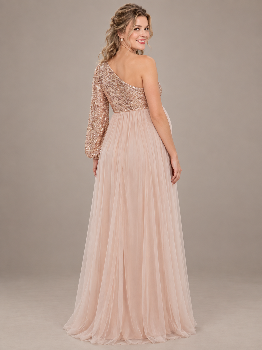 Vivienne Rose Gold maternity dress — back view of the single sleeve and flowing tulle skirt