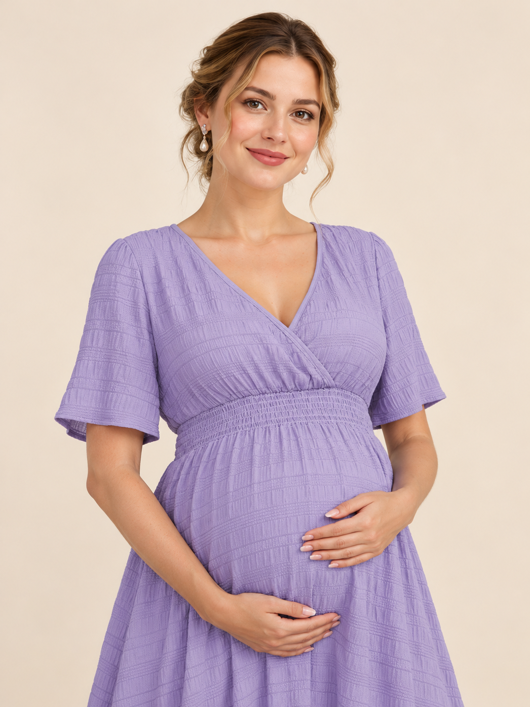 Eugenie Lavender maternity dress — close-up portrait with wrap neckline, smiling