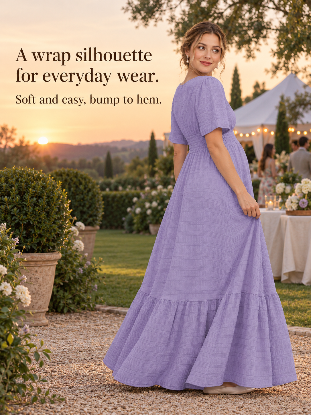 Eugenie Lavender maternity dress — standing at an outdoor evening party with string lights