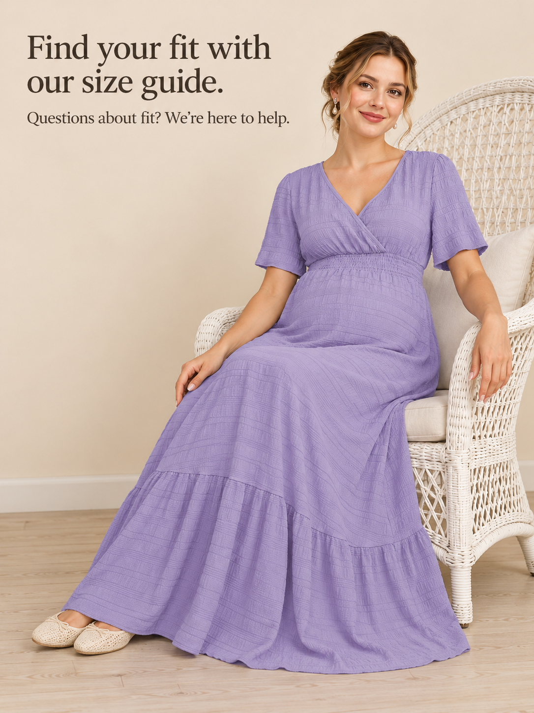 Eugenie Lavender maternity dress — seated in a wicker chair