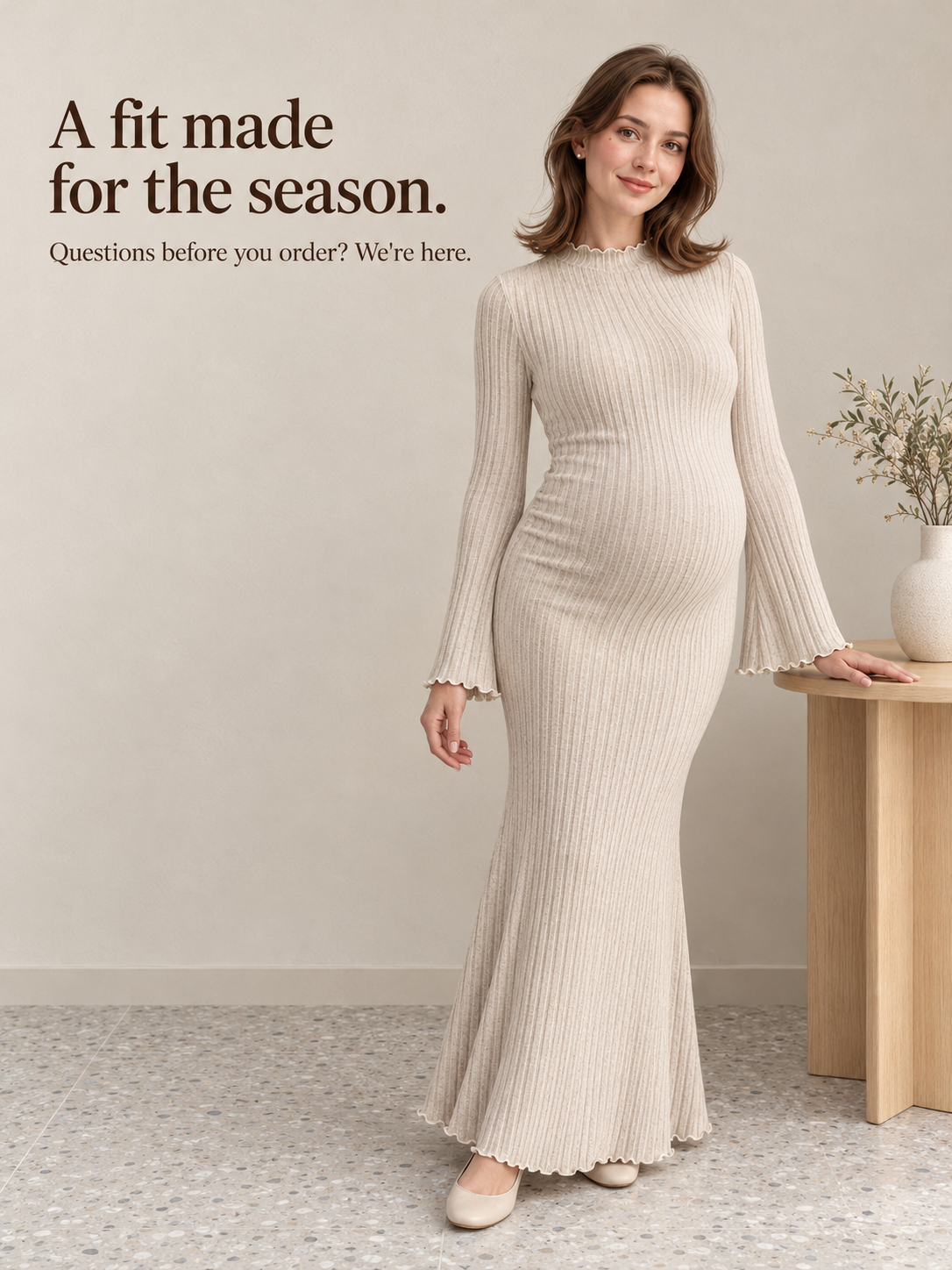 Lucienne Oatmeal maternity dress — standing full length in a softly lit studio