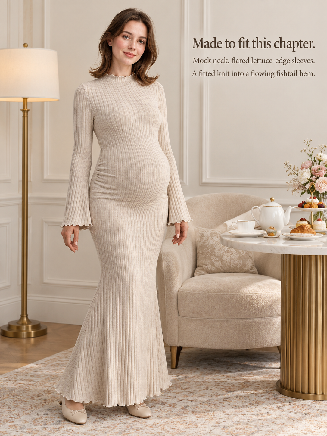 Lucienne Oatmeal maternity dress — standing full length in a cozy styled living room