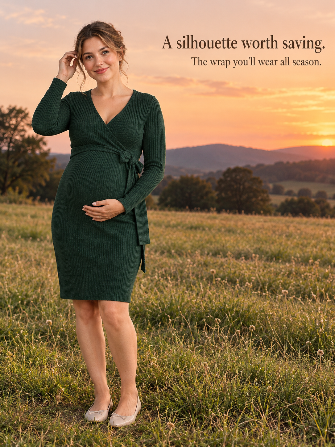Rhea Forest Green maternity dress — standing in a golden field at sunset, touching her hair