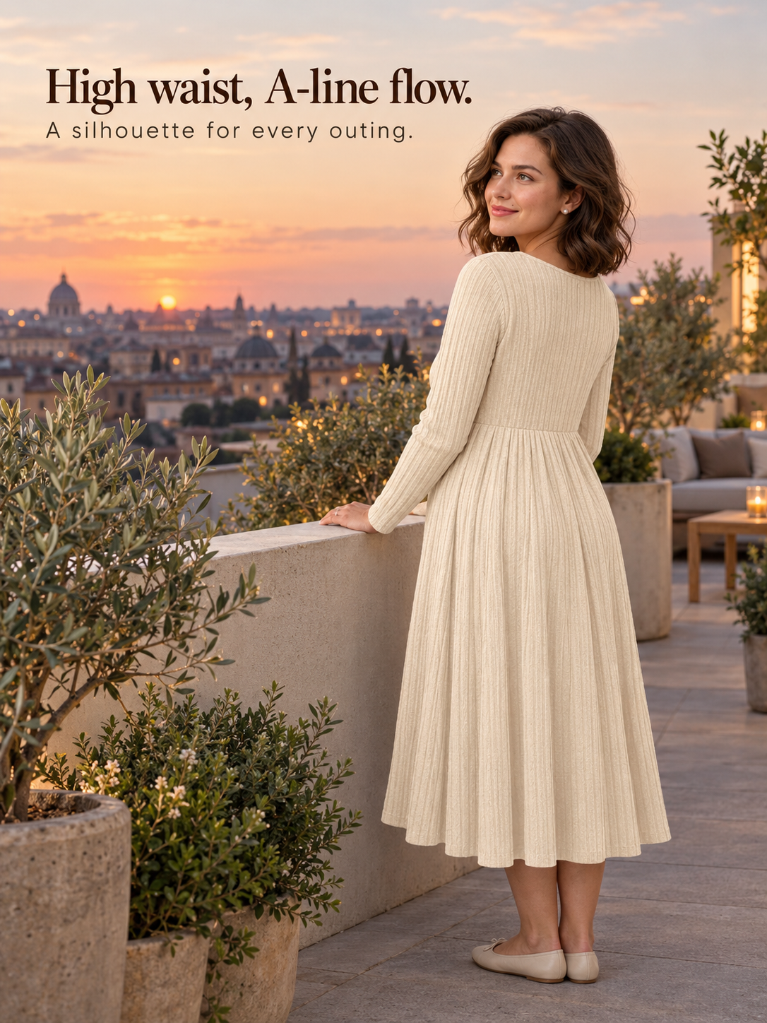 Matilda Apricot maternity dress — standing on a rooftop terrace at sunset over the city