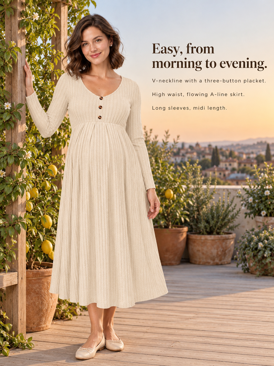 Matilda Apricot maternity dress — standing on a terrace among potted lemon trees