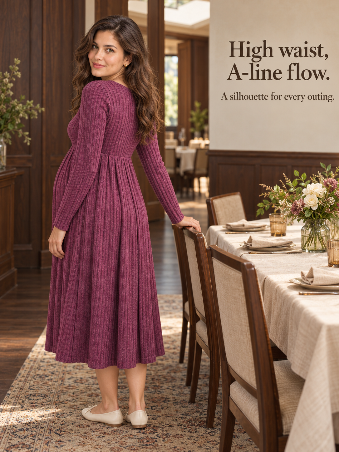 Matilda Wine Red maternity dress — standing by a set dining table in a dining room