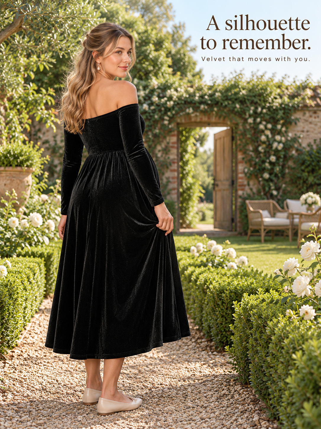 Colette Black maternity dress — walking through a rose-lined garden archway