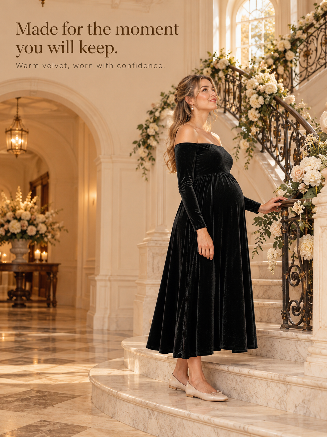 Colette Black maternity dress — standing on a grand staircase with floral garland