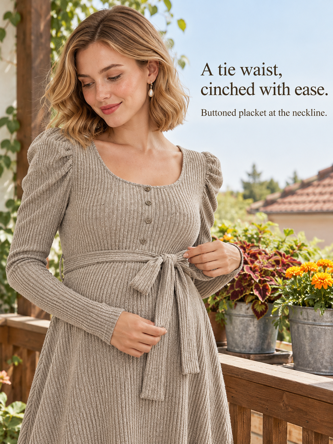 Laurel Oatmeal maternity dress — standing on a balcony touching the tied waist