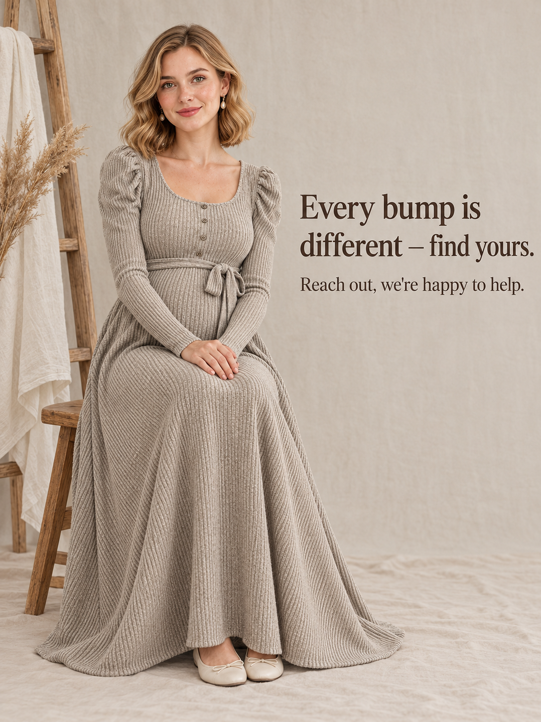 Laurel Oatmeal maternity dress — seated on a wooden stool against a plain backdrop