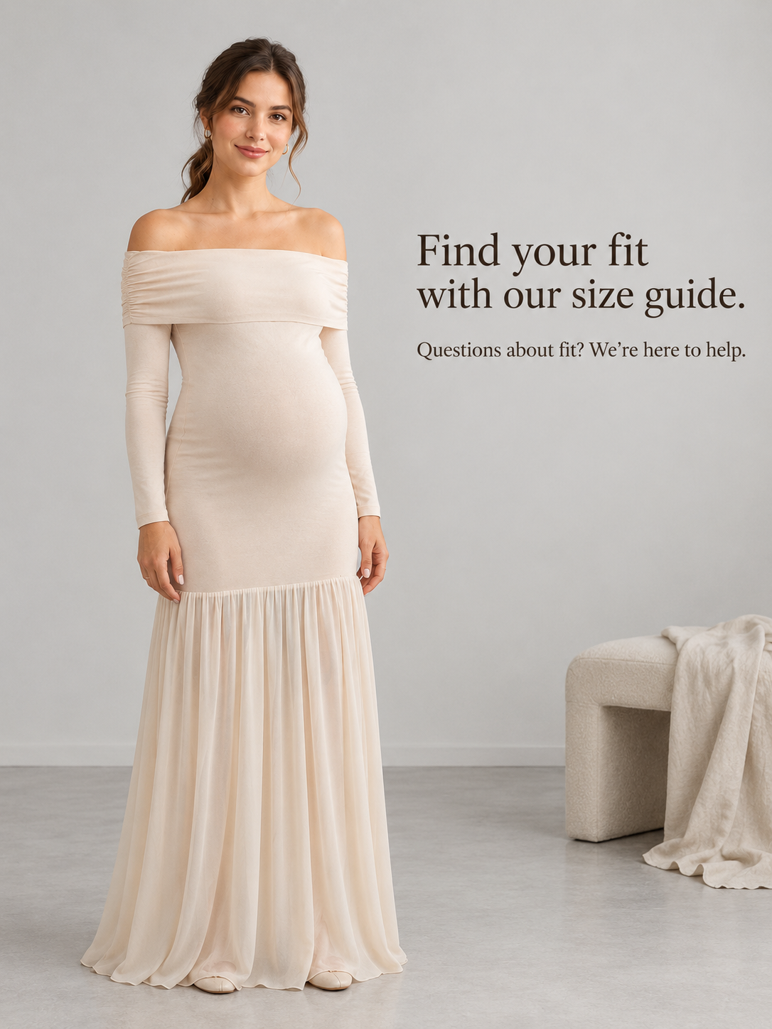 Gabrielle Champagne Beige maternity dress — standing full length in a soft grey studio
