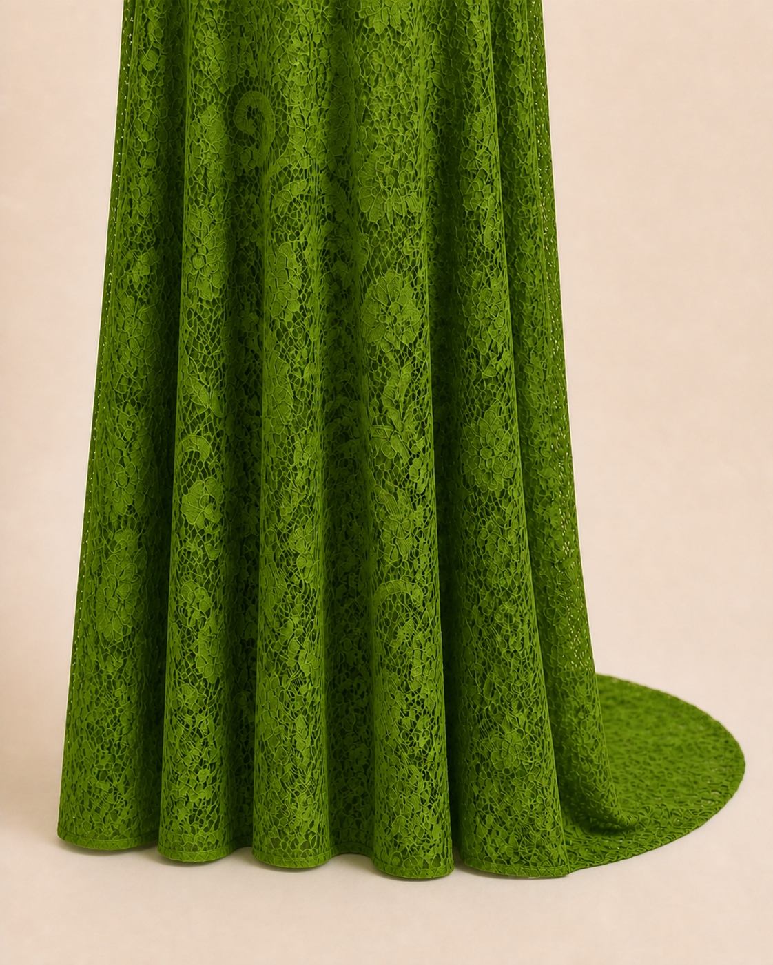 Floor-length Bright Apple Green hem with extra back length falling behind the skirt