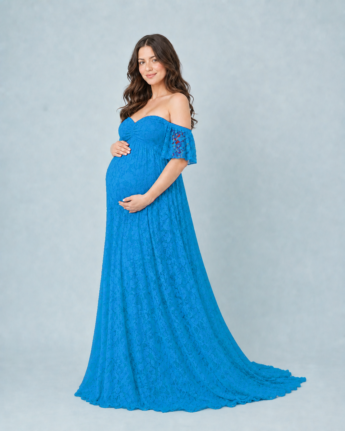 Aqua Blue three-quarter stance showing the empire seam and A-line drape over the bump
