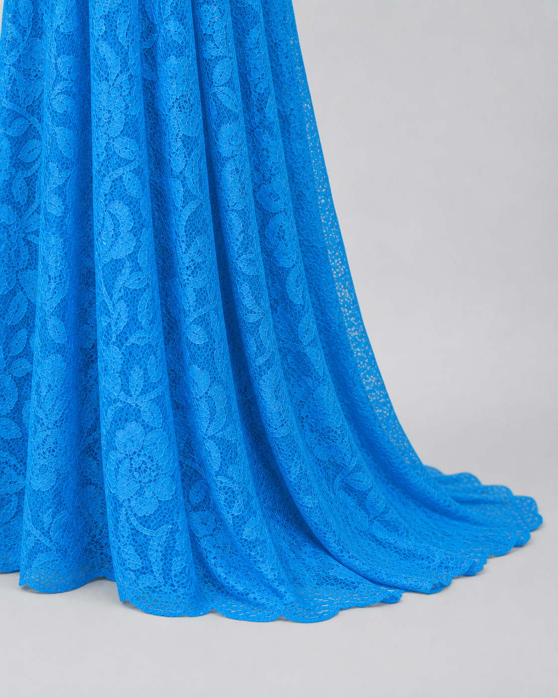 Aqua Blue maxi hem at the floor, longer back fabric trailing in an open fall