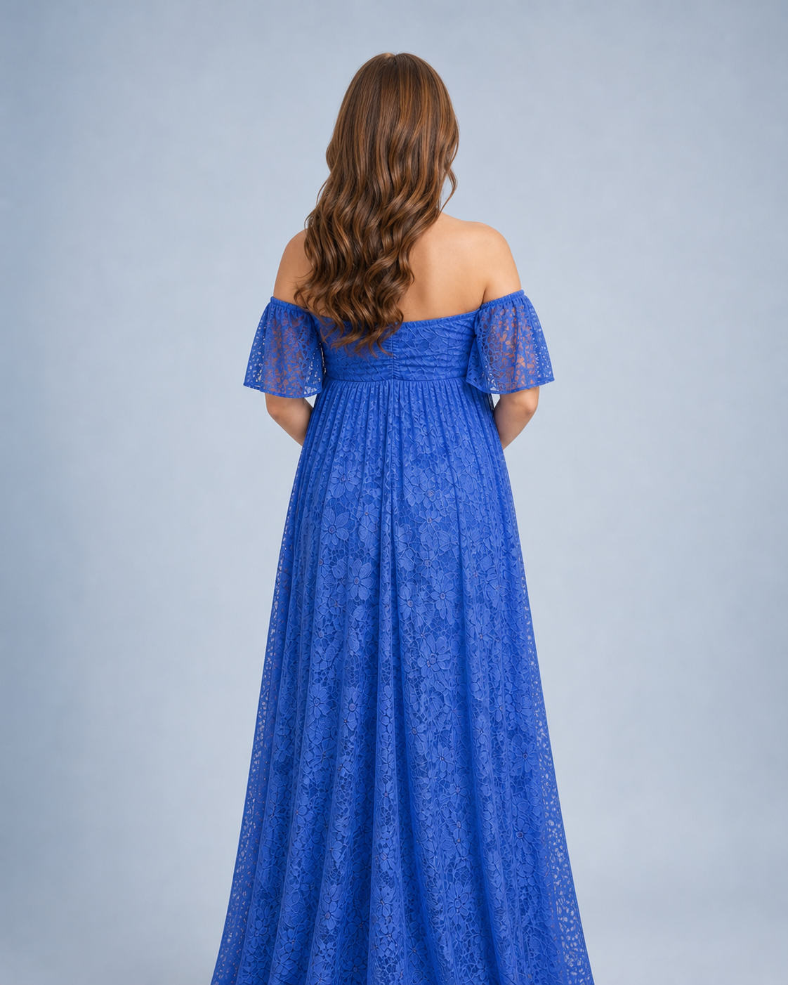 Royal Blue back structure, flutter sleeves and extra length spreading behind the maxi
