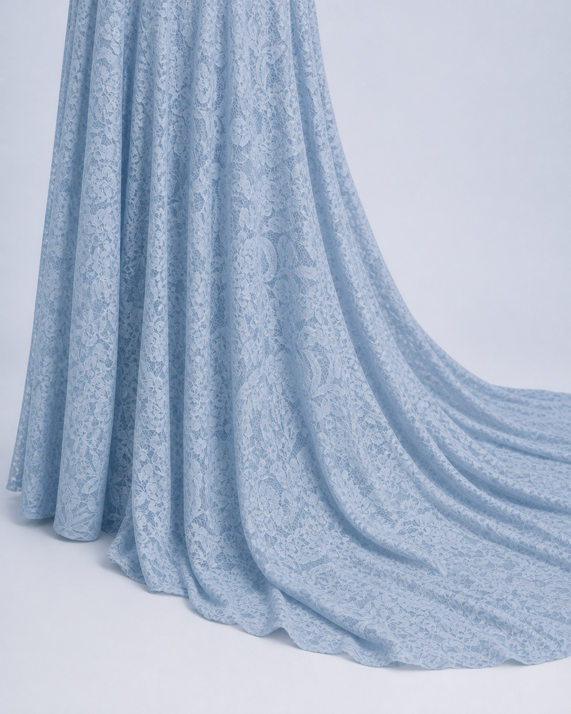 Misty Blue hem at the floor, longer back fabric in a quiet open drape