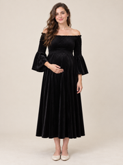 Talia Black maternity dress — front view with off-shoulder smocked bodice and bell sleeves