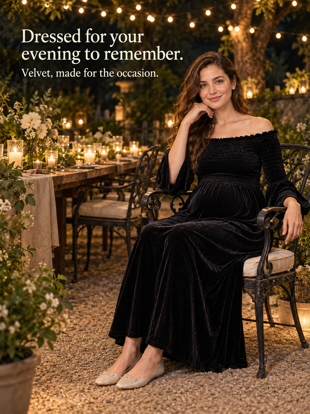 Talia Black maternity dress — seated at a candlelit outdoor evening dinner party
