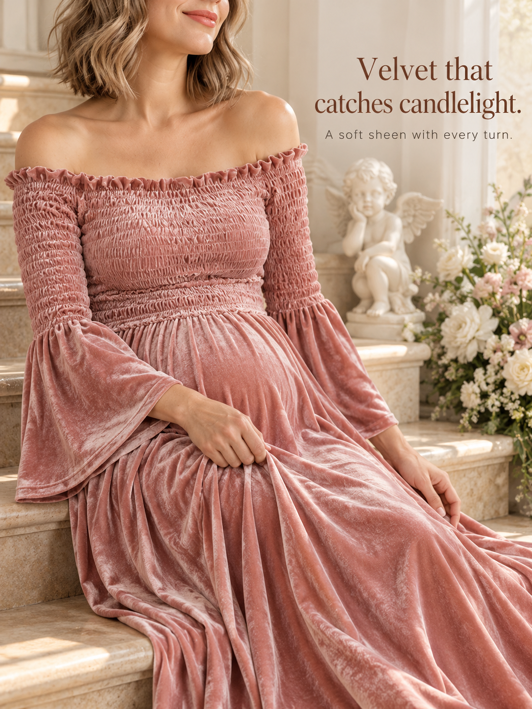Talia Dusty Rose maternity dress — sitting on stone steps beside a garden statue