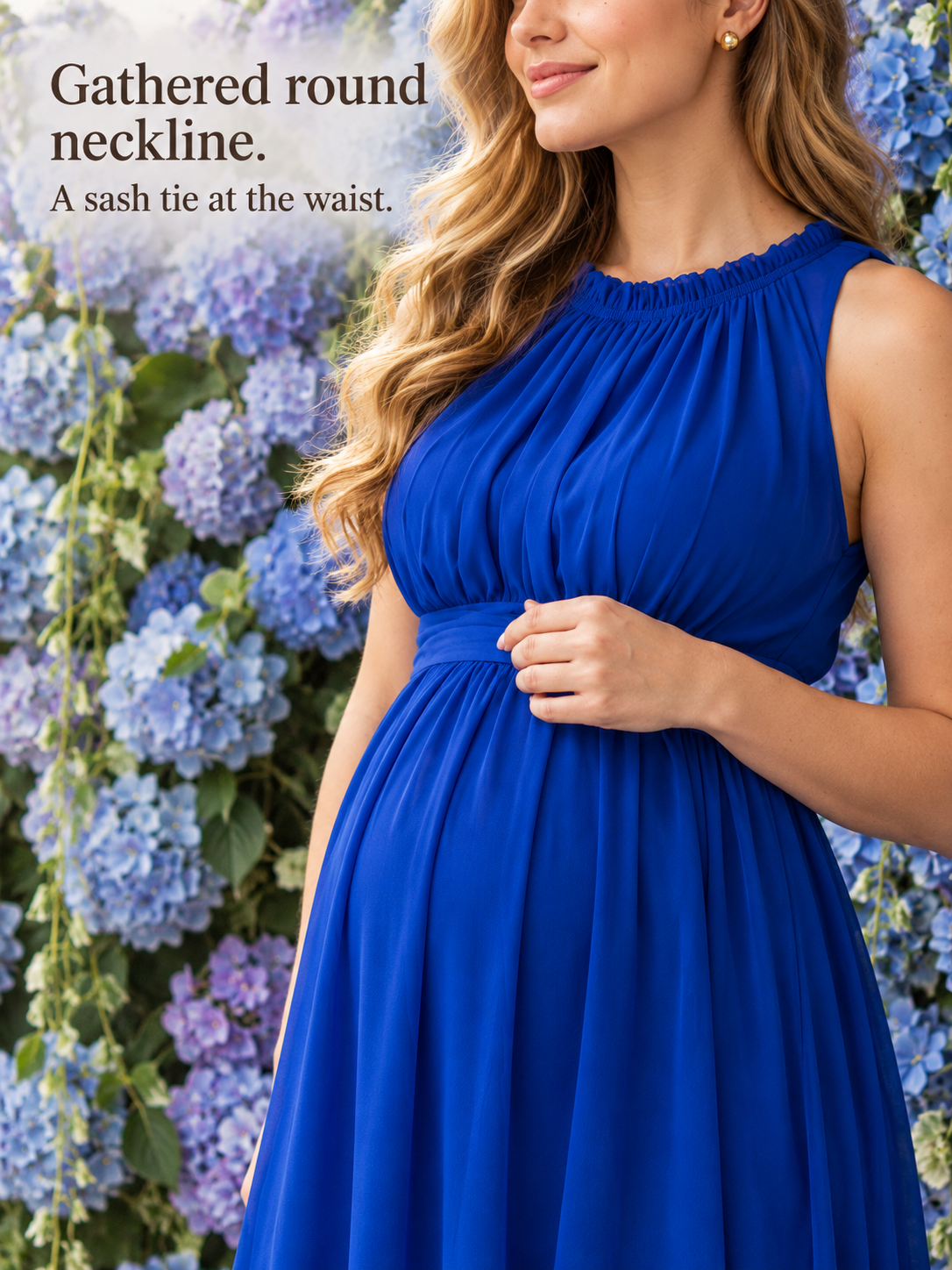 Annelise Royal Blue maternity dress — close-up portrait beside blooming hydrangeas