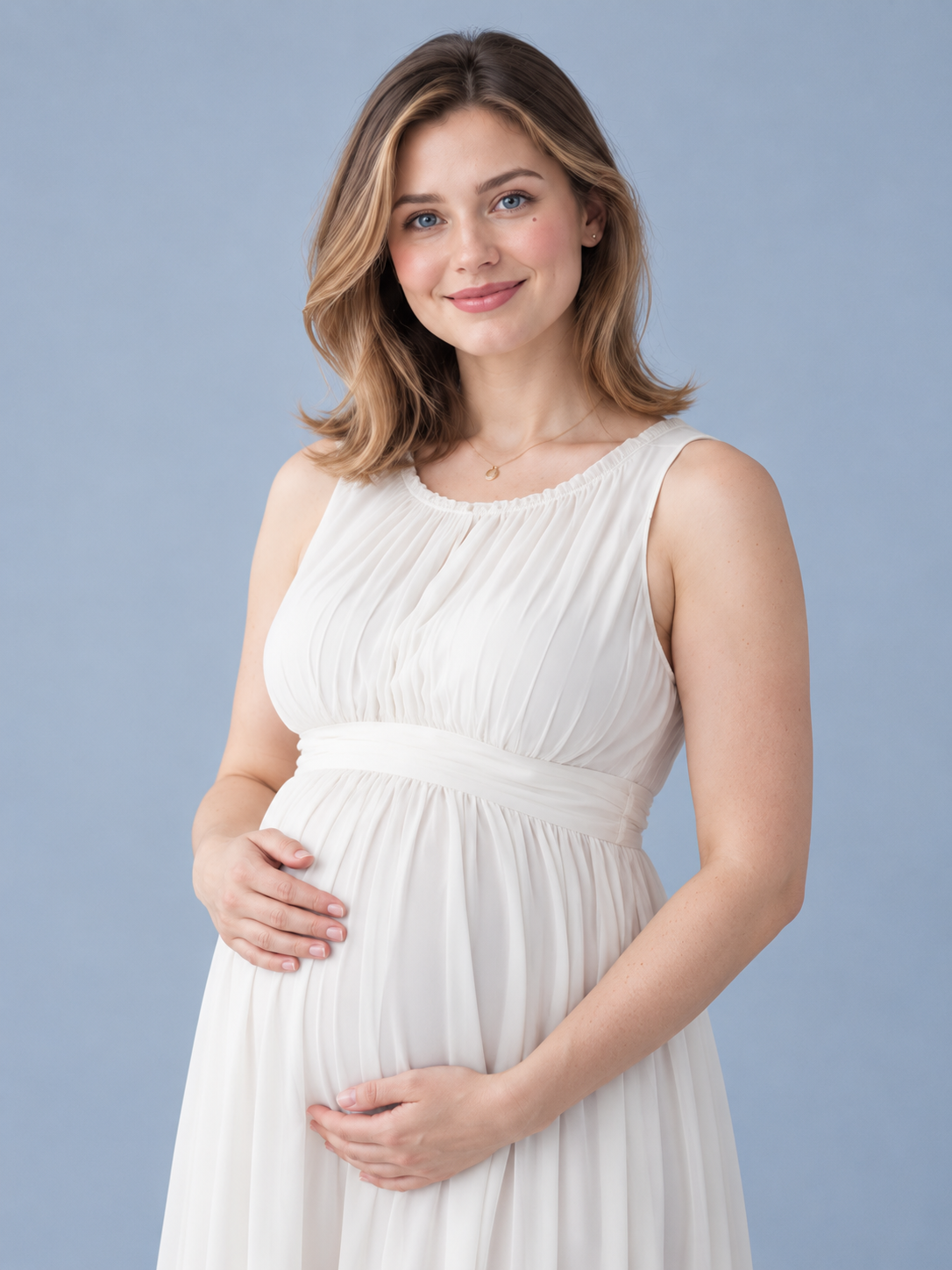 Annelise Ivory maternity dress — close-up portrait with hands clasped at the waist