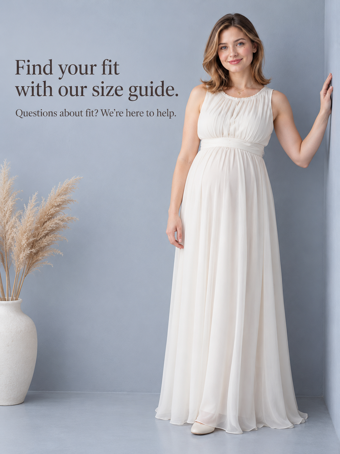 Annelise Ivory maternity dress — standing portrait against a plain wall