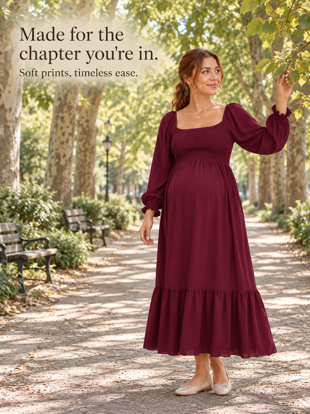 Cecily Wine Red maternity dress — walking along a tree-lined park path