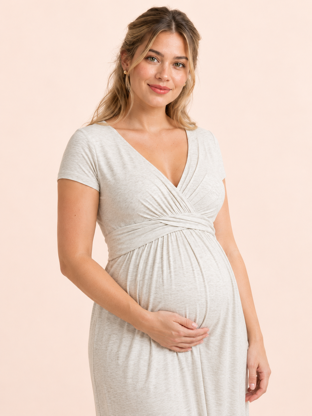Lydia Heather Gray maternity dress — wrap bodice and gathered waist, hand on the bump