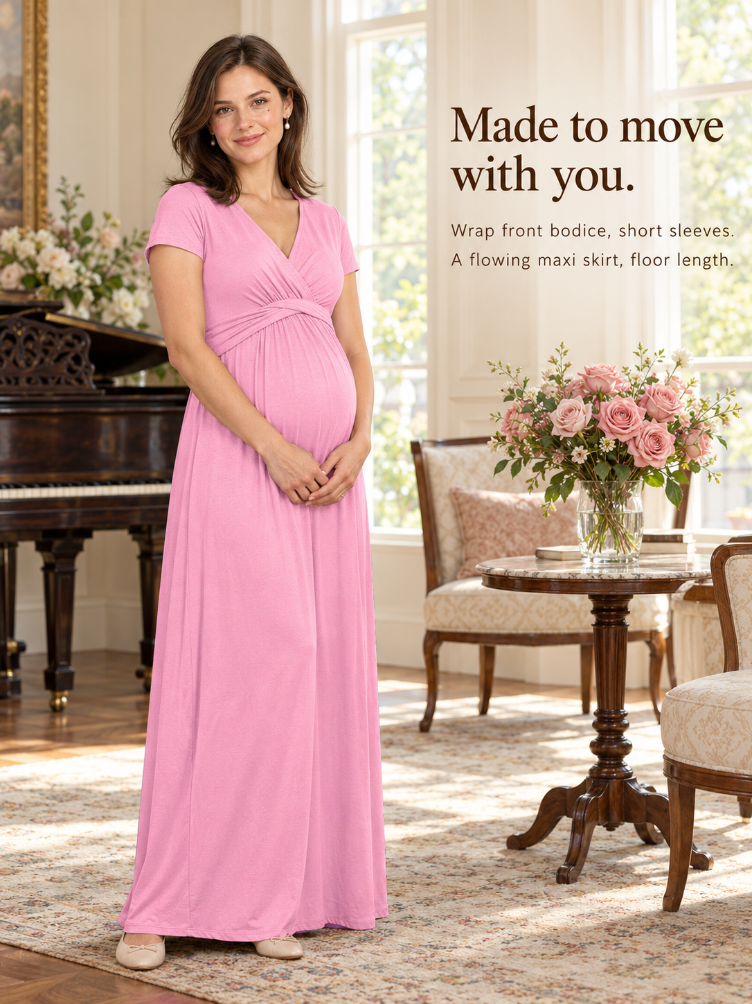 Lydia Rose maternity dress — standing indoors beside a piano and a vase of roses