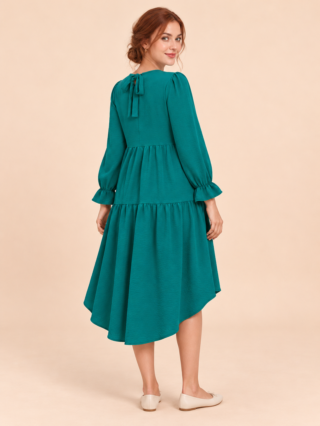 Mila Emerald maternity dress — back view of the tie-back neckline and bow