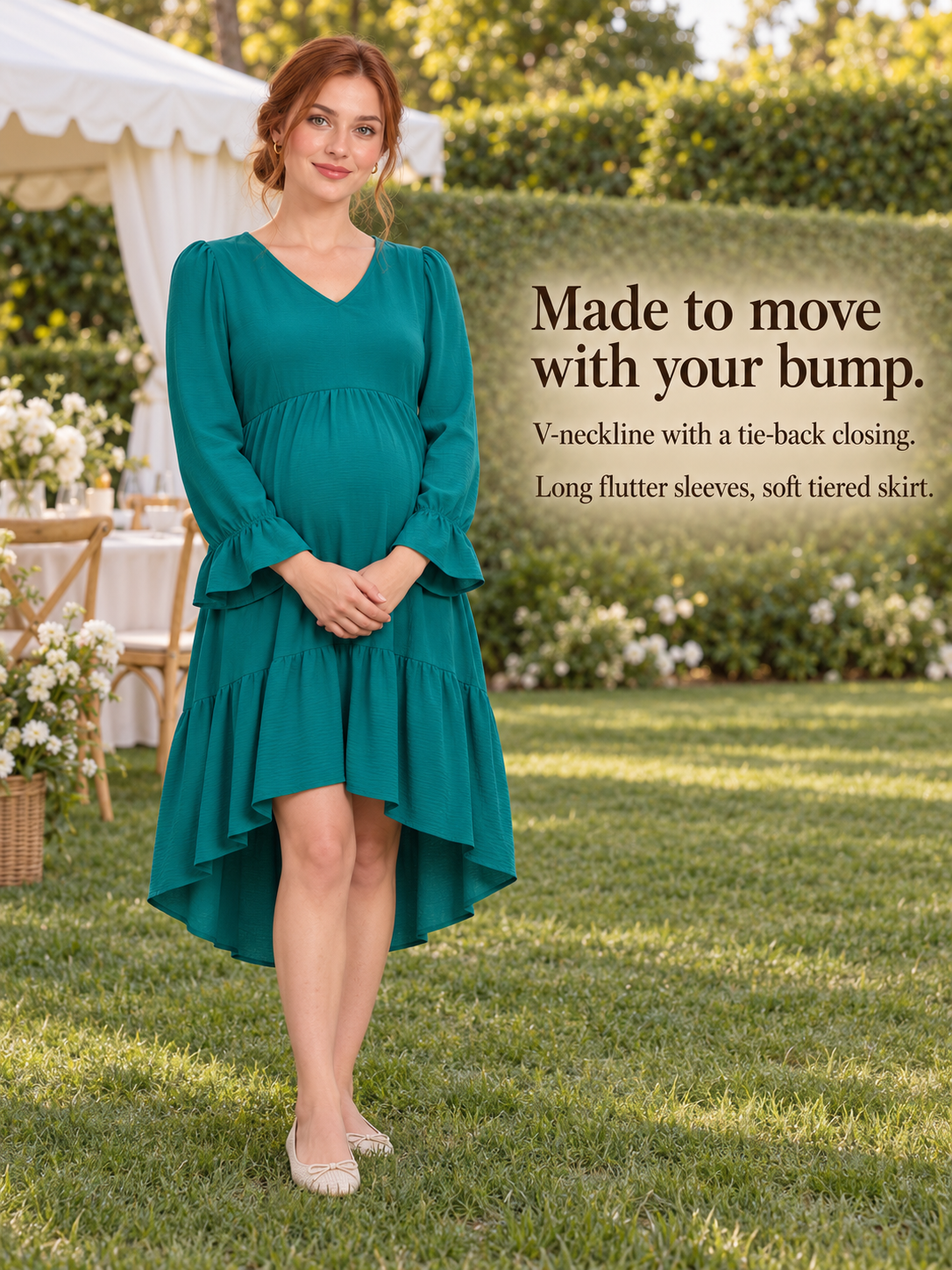 Mila Emerald maternity dress — standing on a lawn near a white tent