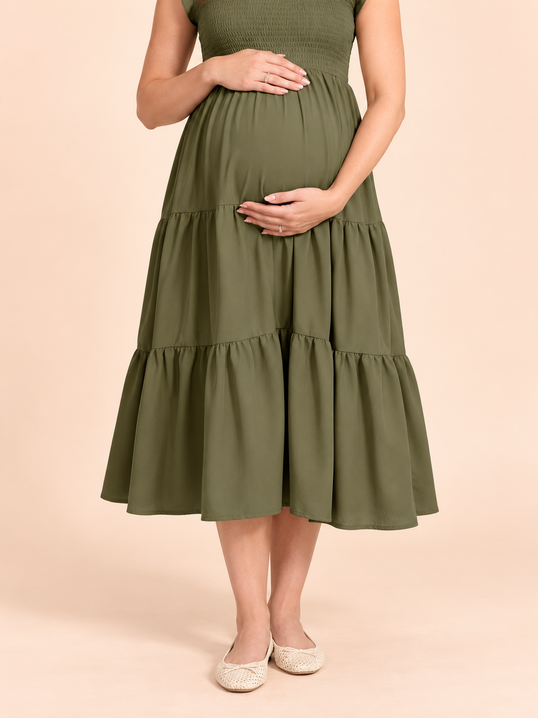 Lisette Olive Green maternity dress — close-up of hands resting on the bump