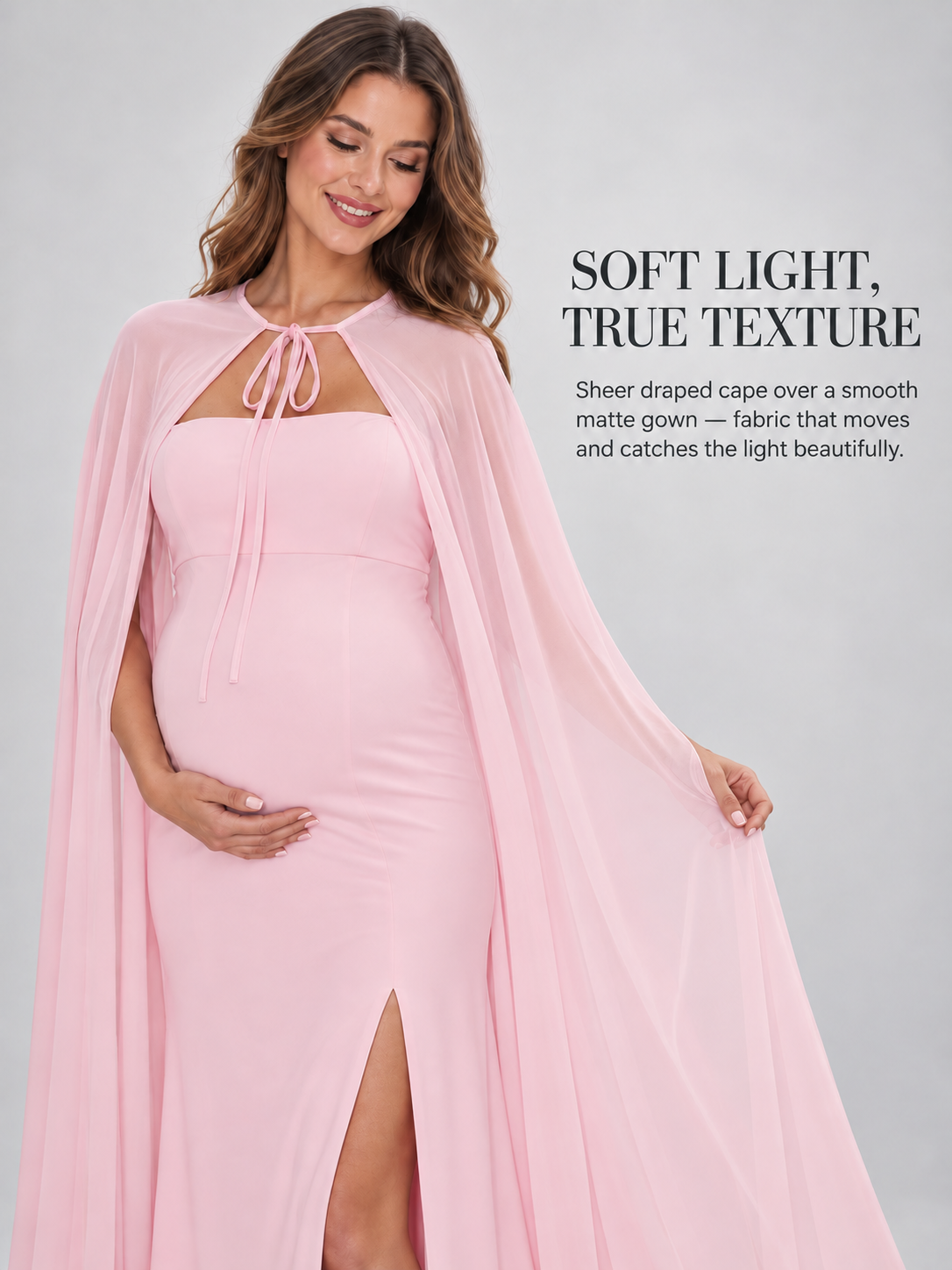 Rosamund Light Pink maternity dress — sheer cape held open over the fitted gown and front slit