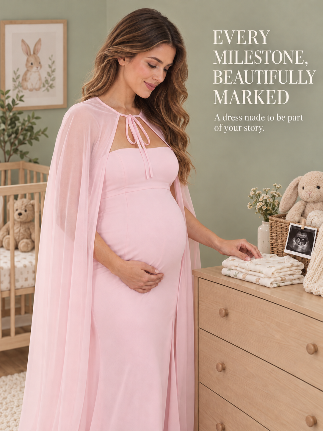 Rosamund Light Pink maternity dress — folding baby clothes in the nursery before the big day