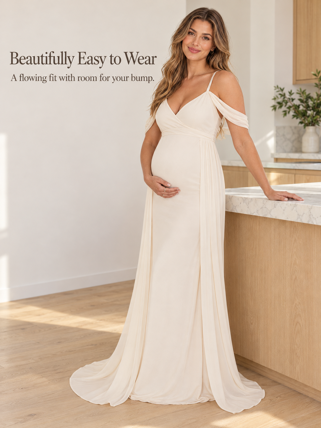 Genevieve Ivory maternity dress — standing at a kitchen counter in natural light