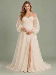 Anouk Champagne maternity dress — front view with off-shoulder wrap bodice, sheer sleeves and high-slit tulle skirt
