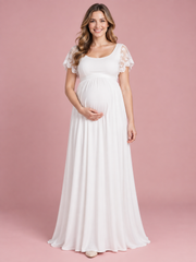 Linnea White maternity dress — front view with scoop neckline, lace flutter sleeves and floor-length skirt