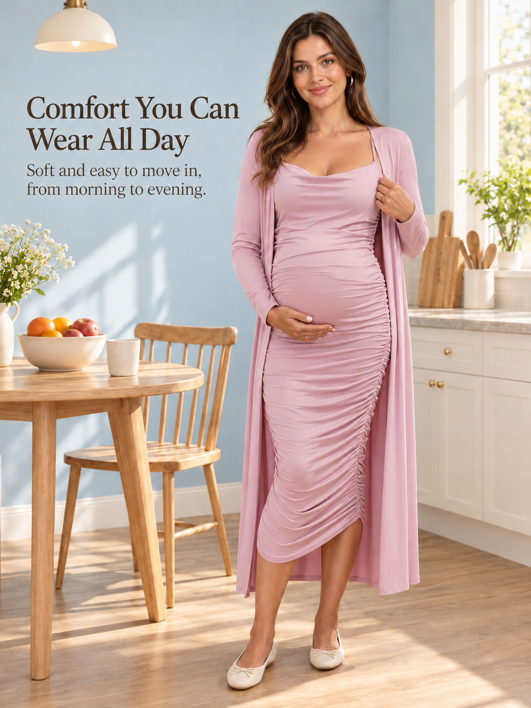Lavinia Dusty Mauve maternity dress — standing in a bright kitchen under a pendant lamp