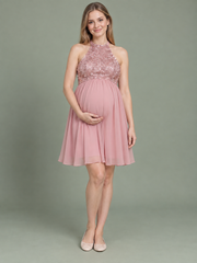 Evelina Dusty Pink maternity dress — front view with halter neckline, sequin bodice and knee-length chiffon skirt