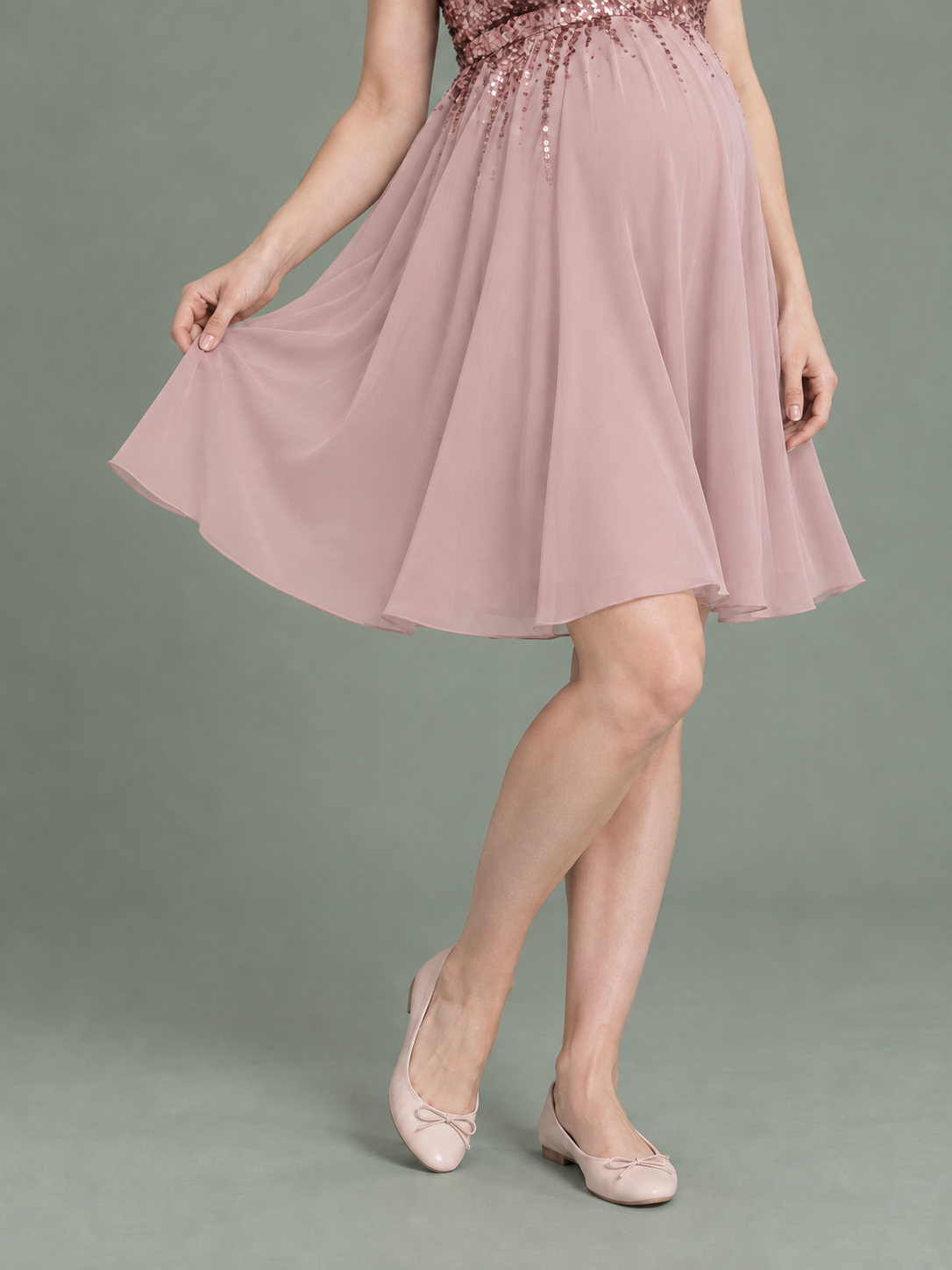 Evelina Dusty Pink maternity dress — holding out the chiffon skirt to show its soft flare