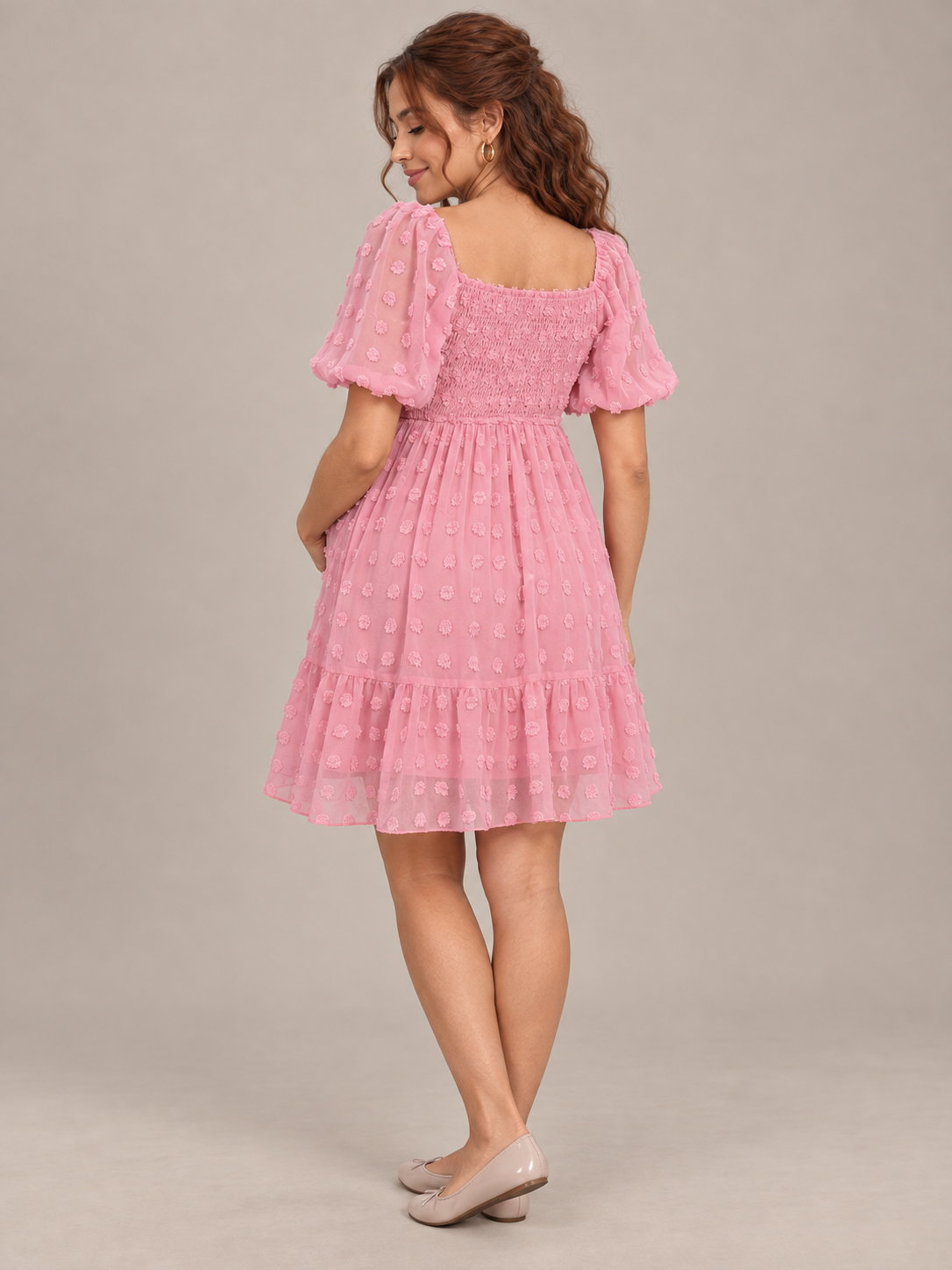 Posy Rose Pink maternity dress — back view of the smocked upper back and puff sleeves