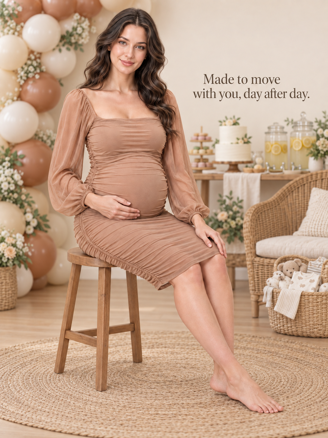 Hazel Camel maternity dress — seated portrait at a baby shower with balloons