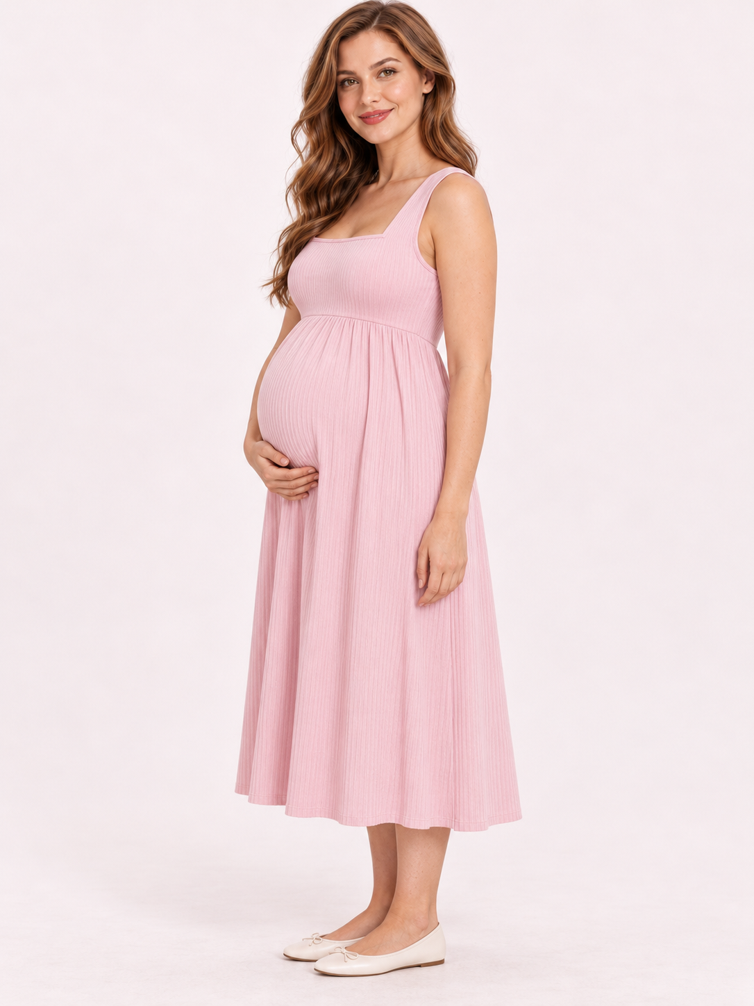 Marcella Blush Pink maternity dress — side view of the high waist and gathered skirt over the bump