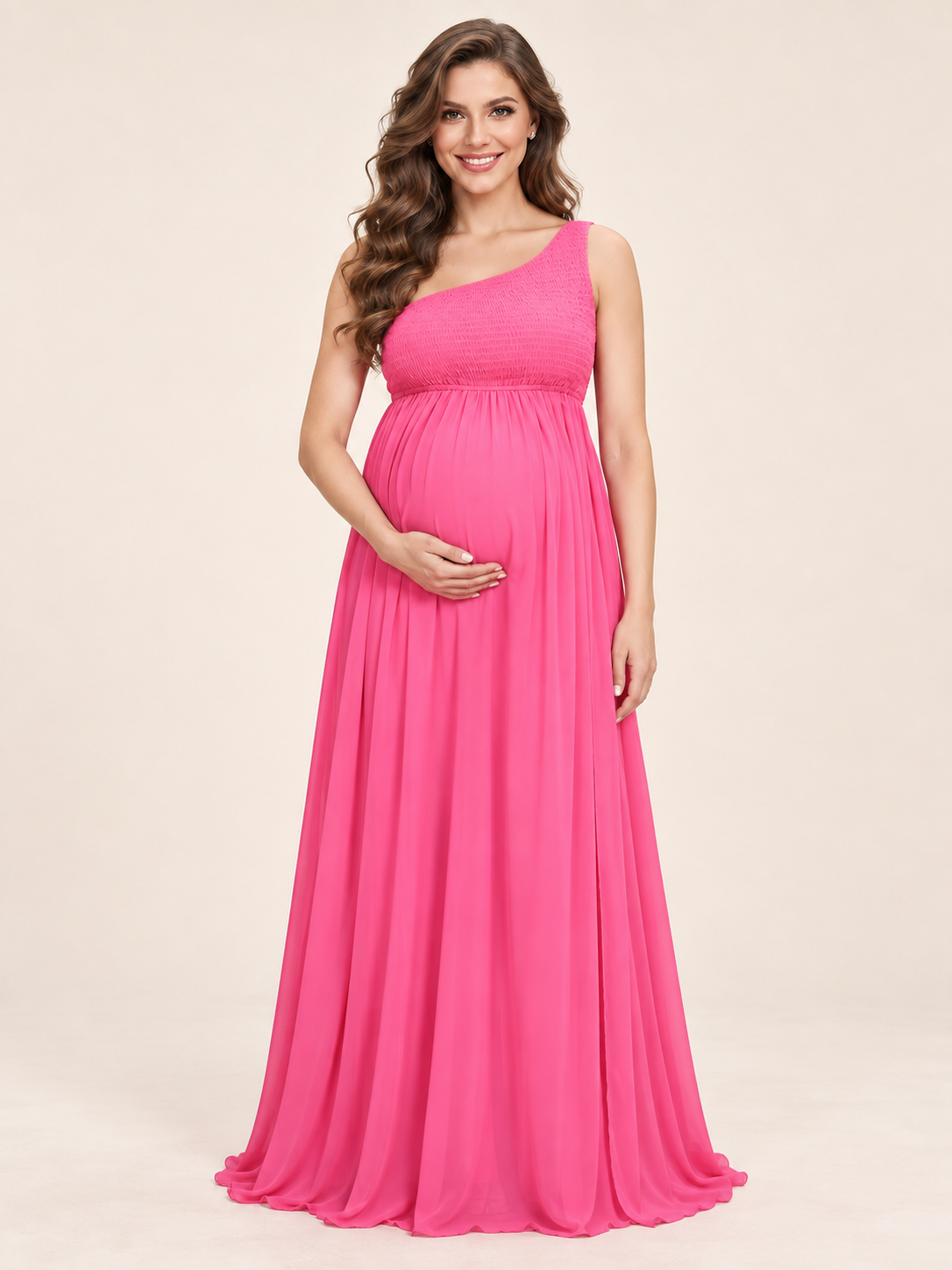 Ophelia Hot Pink maternity dress — front view with one-shoulder smocked bodice and floor-length skirt